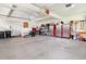 Spacious garage with ample storage, work area, and well-organized equipment at 7724 Kryptonite Ln, Castle Rock, CO 80108