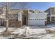 Brick and siding exterior of charming ranch home with attached two-car garage at 7746 S Joplin Ct, Englewood, CO 80112