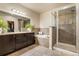 Modern bathroom features a walk-in shower, soaking tub, and dual sink vanity at 9071 E Phillips Dr, Centennial, CO 80112