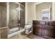 Modern bathroom featuring a tile shower, vanity, and toilet at 9071 E Phillips Dr, Centennial, CO 80112
