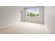 Bright bedroom with a large window offering a view of the neighborhood at 9071 E Phillips Dr, Centennial, CO 80112