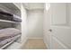 Walk-in closet with shelves and a hanging rod at 9071 E Phillips Dr, Centennial, CO 80112