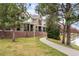 Well-maintained property with walkway, lush trees and grass leading to brick building at 9071 E Phillips Dr, Centennial, CO 80112