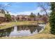 Exterior view of townhomes with water feature and a beautifully landscaped lawn at 9071 E Phillips Dr, Centennial, CO 80112