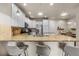 Modern kitchen featuring granite countertops, stainless steel appliances, and stylish pendant lighting at 9071 E Phillips Dr, Centennial, CO 80112