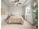 Cozy bedroom featuring a ceiling fan and an exterior view at 9071 E Phillips Dr, Centennial, CO 80112