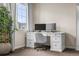 Bright office space featuring a desk, dual monitors, and a comfortable chair at 9071 E Phillips Dr, Centennial, CO 80112
