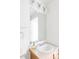 Bright bathroom featuring a white sink with vanity and large mirror with vanity lighting at 1415 N Washington St # 303, Denver, CO 80203