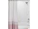 Clean bathroom showcases a tub and shower combination with tiled walls and a shower curtain at 1415 N Washington St # 303, Denver, CO 80203