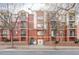 Charming brick apartment building featuring private balconies, manicured lawns, and convenient street parking at 1415 N Washington St # 303, Denver, CO 80203