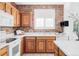 Updated kitchen with white countertops, brick backsplash, stainless appliances, and bright natural light at 1415 N Washington St # 303, Denver, CO 80203