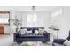 Stylish living room featuring bright windows, comfortable seating, and a desk workspace at 1415 N Washington St # 303, Denver, CO 80203