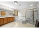 Bright bathroom features double sinks, a tub, and shower at 29825 Kennedy Gulch Rd, Conifer, CO 80433