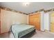 Bedroom features a bed, a closet, and an entrance to another room at 29825 Kennedy Gulch Rd, Conifer, CO 80433