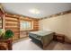 Cozy bedroom with a bed, and built-in shelving at 29825 Kennedy Gulch Rd, Conifer, CO 80433