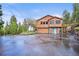 Beautiful multi-level home with a two-car garage, well-maintained grounds, and mature trees at 29825 Kennedy Gulch Rd, Conifer, CO 80433