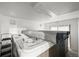 Hot tub room featuring a well-maintained hot tub, bright lighting and sliding glass door at 29825 Kennedy Gulch Rd, Conifer, CO 80433