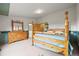 Spacious main bedroom featuring a four-post bed, dresser, and an ensuite bathroom at 29825 Kennedy Gulch Rd, Conifer, CO 80433
