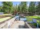 Exterior view of an outbuilding with garden beds at 29825 Kennedy Gulch Rd, Conifer, CO 80433