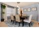 Dining room with a pendant light fixture, neutral decor, and natural light at 11722 W Belmont Pl, Littleton, CO 80127