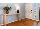 Welcoming entryway with hardwood floors, a console table, and stylish decor for a warm first impression at 11722 W Belmont Pl, Littleton, CO 80127