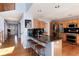 Modern kitchen with stainless steel appliances, granite countertops, and an island with bar seating at 11722 W Belmont Pl, Littleton, CO 80127