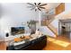 Bright and spacious living room with hardwood floors and vaulted ceilings at 11722 W Belmont Pl, Littleton, CO 80127