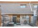 Back of home with brick exterior, sliding glass door, fenced yard, and air conditioning unit at 1791 Quail St, Lakewood, CO 80215