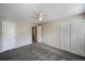 Spacious bedroom with neutral paint, ceiling fan, and large closet at 1791 Quail St, Lakewood, CO 80215