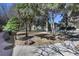 Exterior view of home in a community setting surrounded by trees and lush landscaping at 1791 Quail St, Lakewood, CO 80215