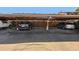Covered parking area with multiple parking spaces and parked vehicles at 1791 Quail St, Lakewood, CO 80215