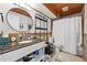 Stylish bathroom with granite vanity, modern fixtures, and plenty of storage space at 34788 Forest Estates Rd, Evergreen, CO 80439