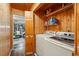 Convenient laundry room with modern washer and dryer, and ample storage space at 34788 Forest Estates Rd, Evergreen, CO 80439