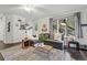 Bright living room with a comfortable sofa, large windows, and stylish decor at 34788 Forest Estates Rd, Evergreen, CO 80439
