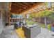 Landscaped backyard featuring a covered patio with stylish outdoor furniture at 8510 Union Cir, Arvada, CO 80005