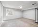 Spacious basement area with neutral carpet and a window for natural light at 8510 Union Cir, Arvada, CO 80005