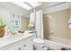 Neutral bathroom features a bathtub, toilet, white cabinets, and a skylight at 8510 Union Cir, Arvada, CO 80005