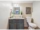 Cozy bathroom with dark vanity and updated fixtures at 8510 Union Cir, Arvada, CO 80005
