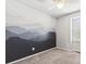 Bright bedroom featuring a wall mural, neutral carpet, and natural light at 8510 Union Cir, Arvada, CO 80005