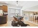 Cozy dining area featuring a modern table setting, hardwood floors, and easy access to the kitchen at 8510 Union Cir, Arvada, CO 80005