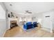 Cozy living room features a brick fireplace, hardwood floors, and stylish decor at 8510 Union Cir, Arvada, CO 80005