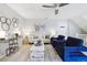 Comfortable living room with ceiling fan, modern furniture, and neutral color palette at 8510 Union Cir, Arvada, CO 80005