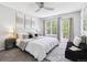 Serene main bedroom with large windows, ceiling fan, and plush carpeting at 8510 Union Cir, Arvada, CO 80005