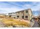 Large backyard with a stone patio, mature landscaping, and privacy fence, ideal for outdoor enjoyment at 9703 Ogden Ct, Thornton, CO 80229