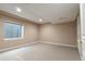 Spacious basement with carpet and a window bringing in natural light at 9703 Ogden Ct, Thornton, CO 80229