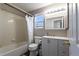 Bathroom with a tub and shower combination, a white vanity and neutral walls at 9703 Ogden Ct, Thornton, CO 80229