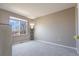 Bedroom with carpet and a large window letting in lots of natural light at 9703 Ogden Ct, Thornton, CO 80229