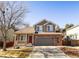 Charming two-story home with a well-maintained front yard and inviting curb appeal at 9703 Ogden Ct, Thornton, CO 80229