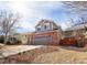 Two-story home featuring neutral siding and a well-manicured lawn on a sunny day at 9703 Ogden Ct, Thornton, CO 80229