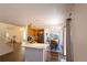 Open concept kitchen with breakfast bar, stainless appliances, and adjacent dining area at 9703 Ogden Ct, Thornton, CO 80229